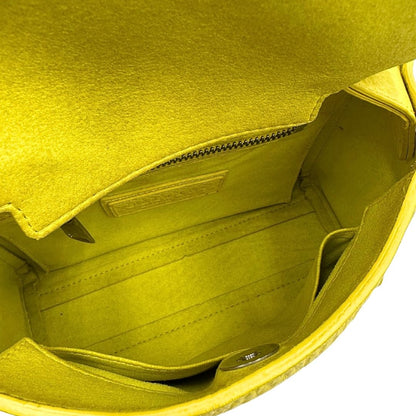 interno Borsa Orciani in pelle martellata gialla con parti metalliche argentate; munita di un manico singolo e una tracolla amovibile e regolabile, di lusso, originale, ottime condizioni. 