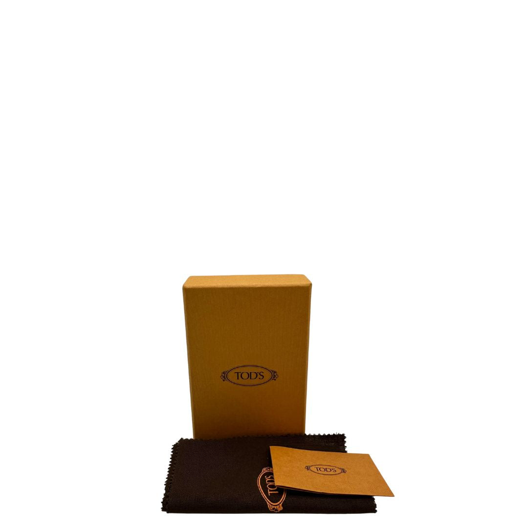 Portafoglio Tod's in pelle color turchese con parti metalliche argentate. Completo di corredo, di lusso, originale, ottime condizioni.