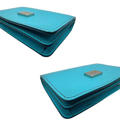 Portafoglio Tod's in pelle color turchese con parti metalliche argentate. Completo di corredo, di lusso, originale, ottime condizioni.