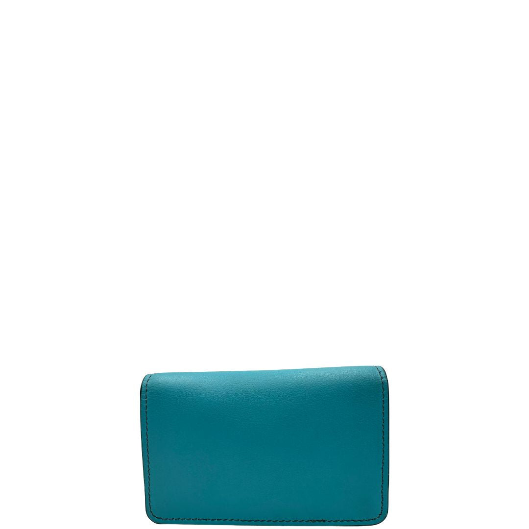 Portafoglio Tod's in pelle color turchese con parti metalliche argentate. Completo di corredo, di lusso, originale, ottime condizioni.