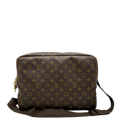 Retro di una Borsa LV in canvas marrone monogram con finiture in vacchetta naturale e metalleria dorata, munita di una tracolla in tessuto regolabile. Completa di dustbag, lucchetti e chiavi. Originale, usata, di lusso, in ottime condizioni