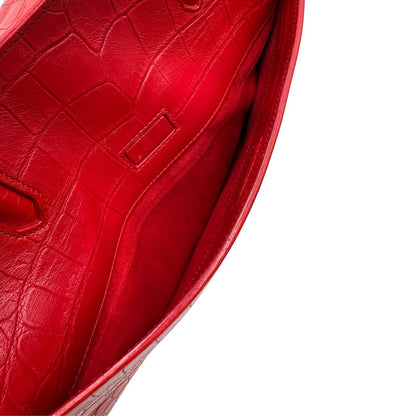 interno Borsa Saint Laurent in pelle cocco rossa con parti metalliche argentate: munita di doppi manici stondati e una tracolla amovibile e regolabile. Completa di dustbag, di lusso, originale, ottime condizioni. 