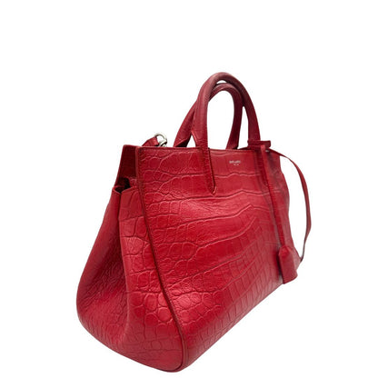 lato Borsa Saint Laurent in pelle cocco rossa con parti metalliche argentate: munita di doppi manici stondati e una tracolla amovibile e regolabile. Completa di dustbag, di lusso, originale, ottime condizioni. 
