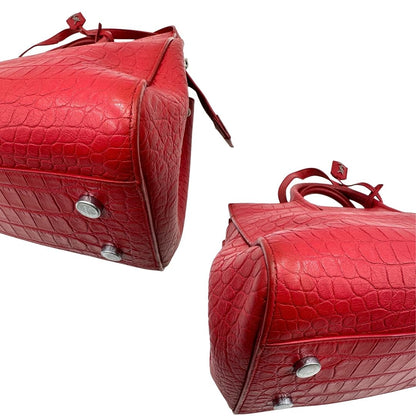 angoli Borsa Saint Laurent in pelle cocco rossa con parti metalliche argentate: munita di doppi manici stondati e una tracolla amovibile e regolabile. Completa di dustbag, di lusso, originale, ottime condizioni.