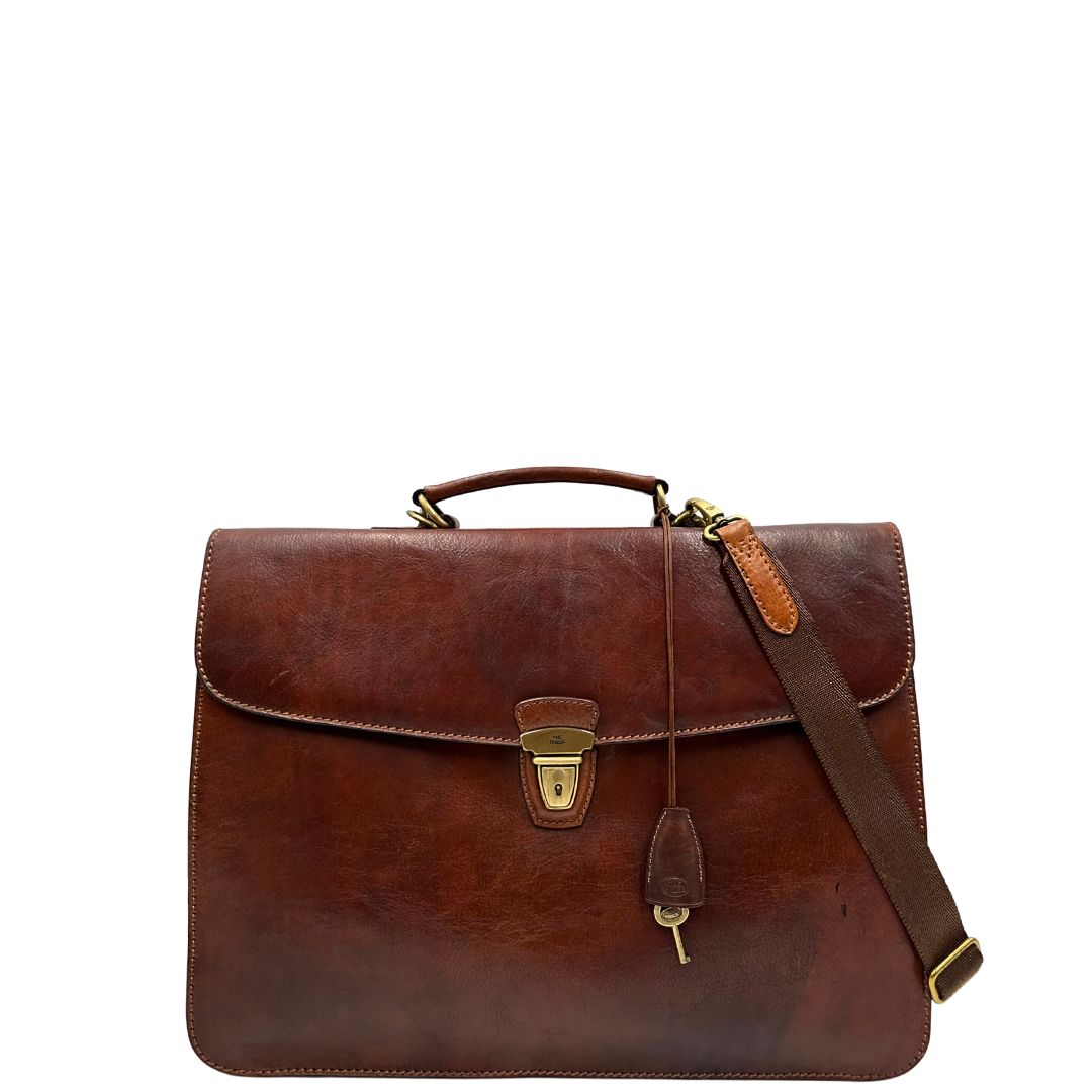 front  Cartella The Bridge in cuoio marrone con parti metalliche oro anticato; dotata di manico, una tracolla regolabile e amovibile e una clochette portachiavi, di lusso, originale, ottime condizioni, usata. 