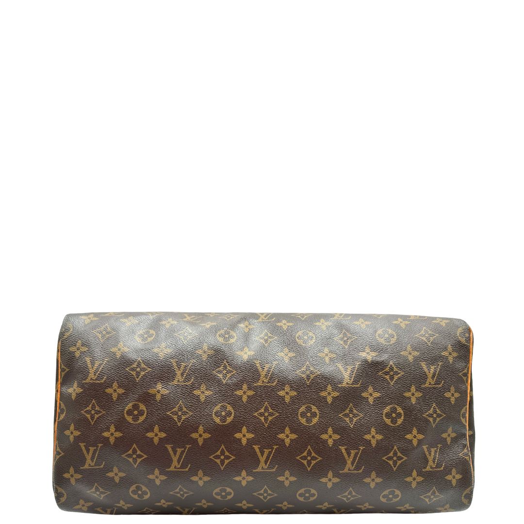 Base di una Borsa Louis Vuitton in canvas marrone monogram con finiture in vacchetta naturale e parti metalliche dorate; munita di doppi manici stondati. Originale, usato, di lusso, in ottime condizioni.