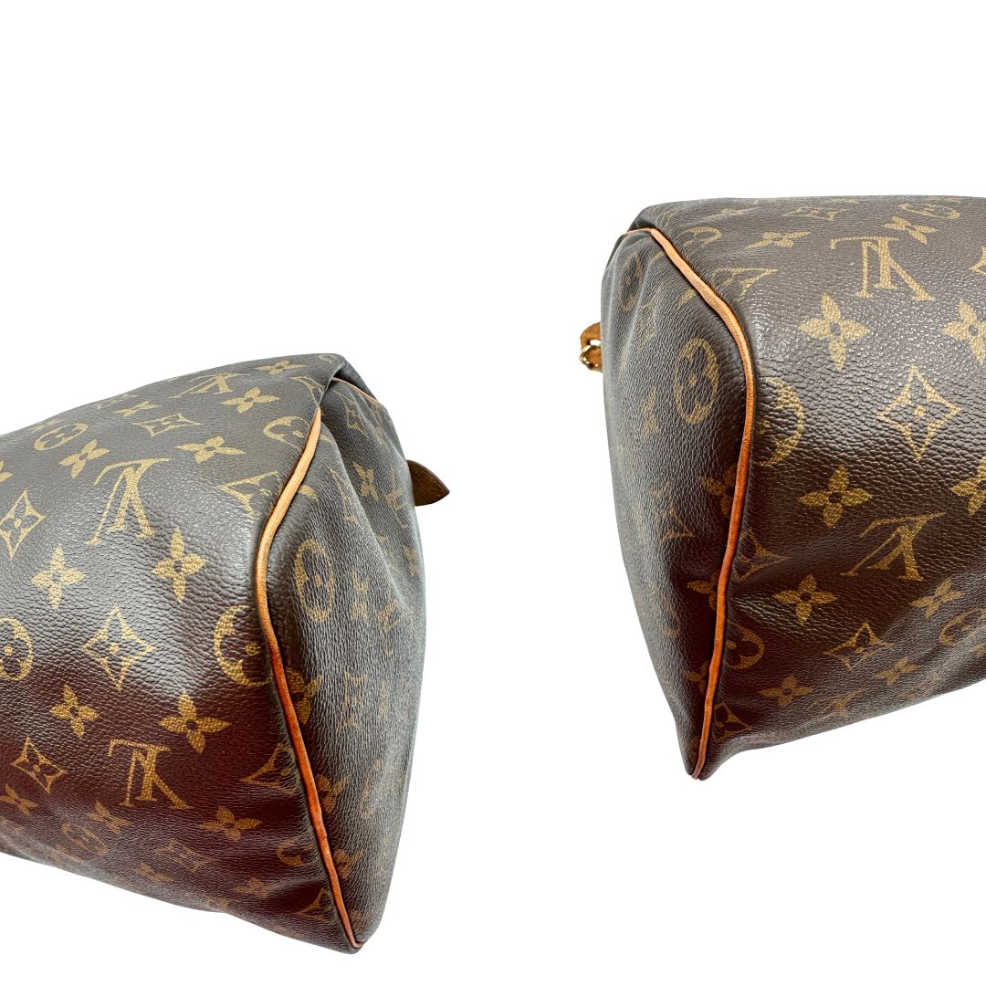 Angoli di una Borsa Louis Vuitton in canvas marrone monogram con finiture in vacchetta naturale e parti metalliche dorate; munita di doppi manici stondati. Originale, usato, di lusso, in ottime condizioni.