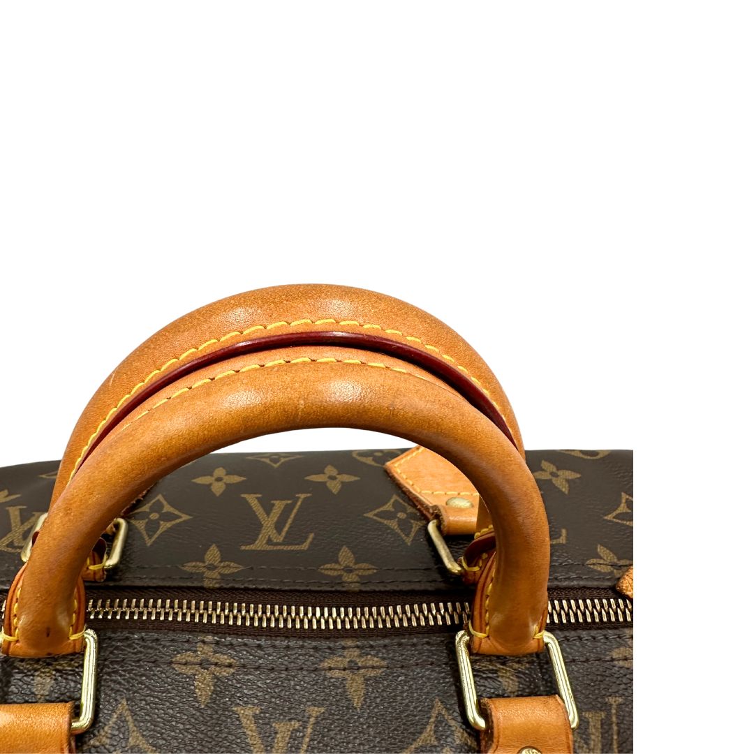 Manici di una Borsa Louis Vuitton in canvas marrone monogram con finiture in vacchetta naturale e parti metalliche dorate; munita di doppi manici stondati. Originale, usato, di lusso, in ottime condizioni.