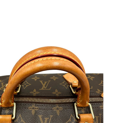 Manici di una Borsa Louis Vuitton in canvas marrone monogram con finiture in vacchetta naturale e parti metalliche dorate; munita di doppi manici stondati. Originale, usato, di lusso, in ottime condizioni.