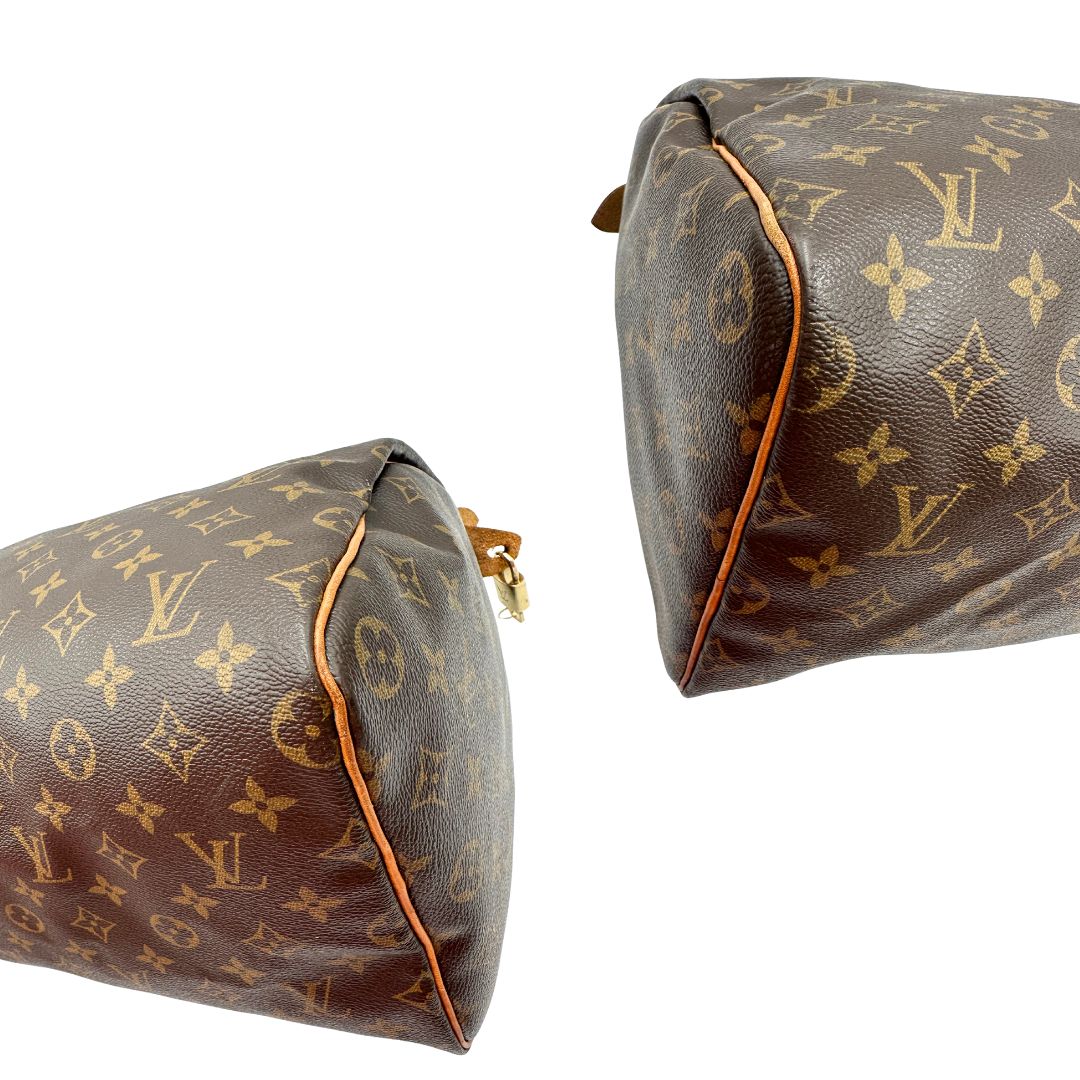 Angoli di una Borsa Louis Vuitton in canvas marrone monogram con finiture in vacchetta naturale e parti metalliche dorate; munita di doppi manici stondati. Originale, usato, di lusso, in ottime condizioni.