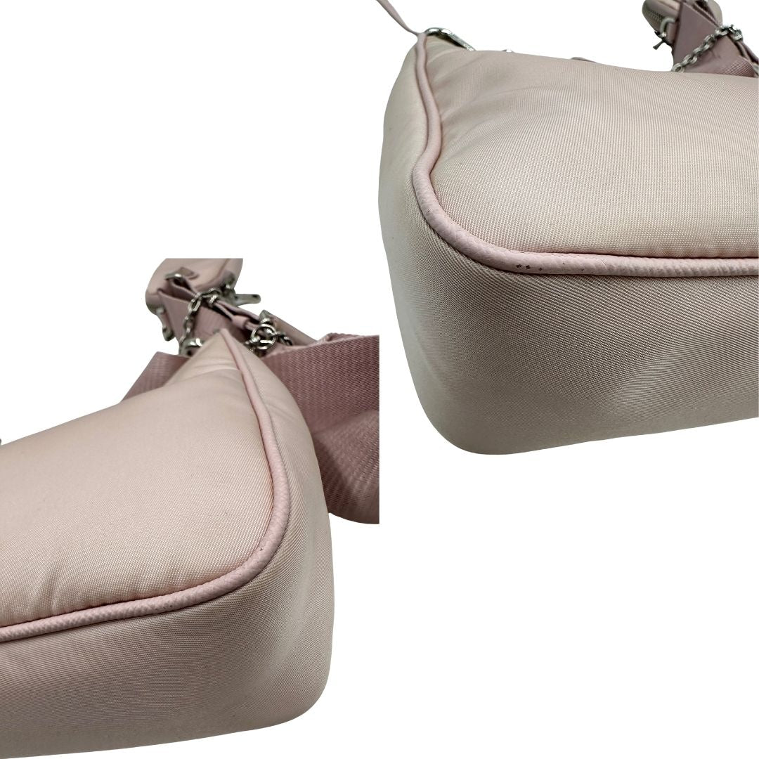 angoli Borsa Prada in nylon rosa con parti metalliche argentate e finiture in pelle tono su tono; munita di un mini pouch amovibile, un accessorio portachiavi, manico in catena e una tracolla in tessuto amovibile e regolabile, di lusso, originale, ottime condizioni. 