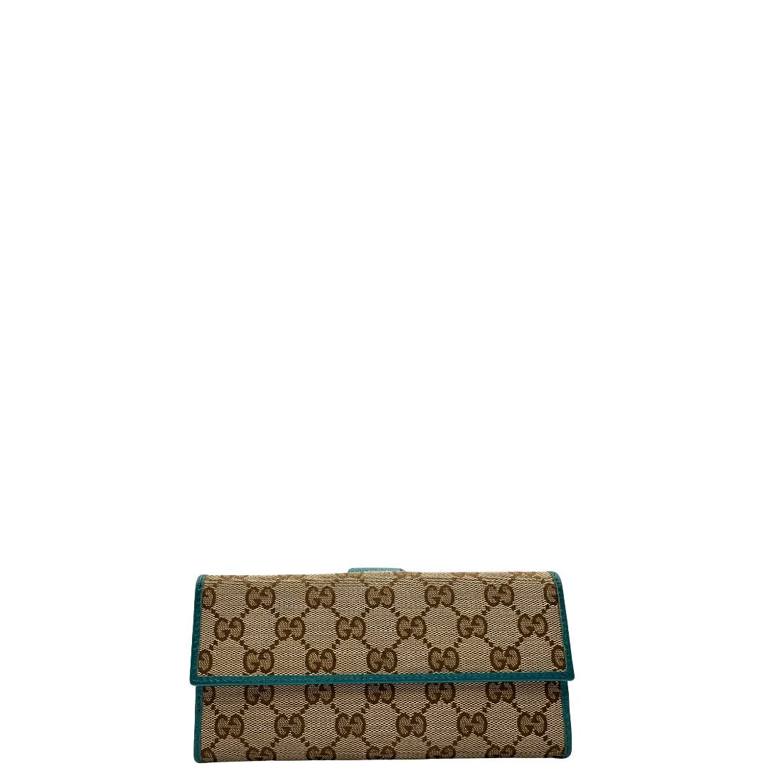 Portafoglio Gucci in tessuto GG con finiture in pelle color turchese. Completo di sacchetto antipolvere, di lusso, originale, ottime condizioni.