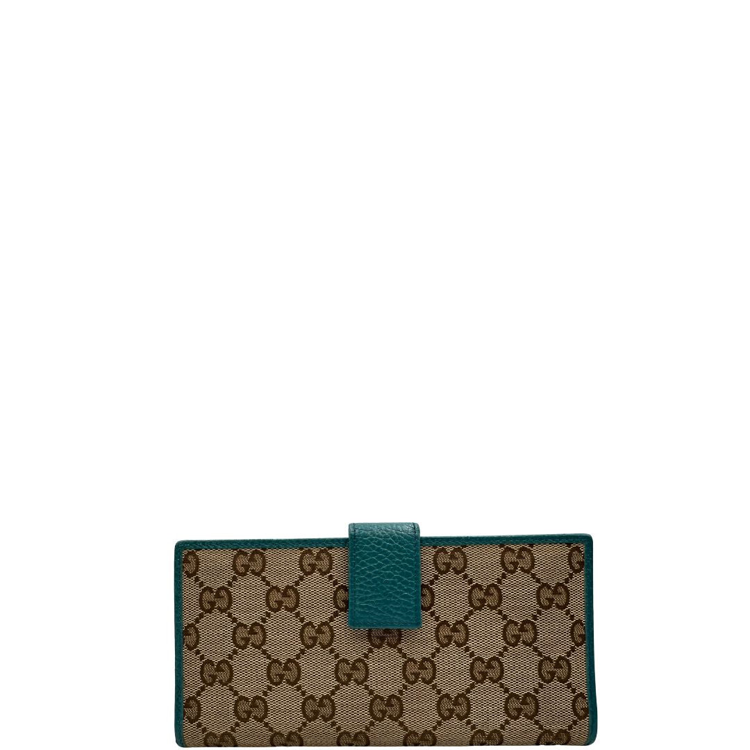 Portafoglio Gucci in tessuto GG con finiture in pelle color turchese. Completo di sacchetto antipolvere, di lusso, originale, ottime condizioni.