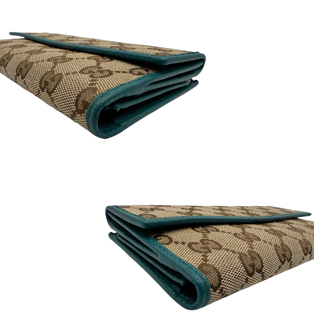 Portafoglio Gucci in tessuto GG con finiture in pelle color turchese. Completo di sacchetto antipolvere, di lusso, originale, ottime condizioni.