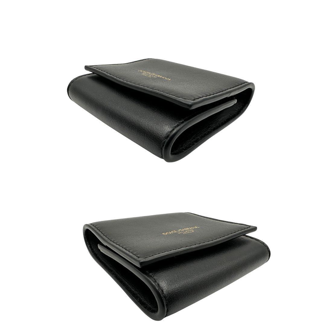 Portamonete Dolce & Gabbana in pelle nera con dettagli dorati. Completo di corredo, di lusso, originale, eccellenti condizioni.