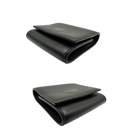 Portamonete Dolce & Gabbana in pelle nera con dettagli dorati. Completo di corredo, di lusso, originale, eccellenti condizioni.