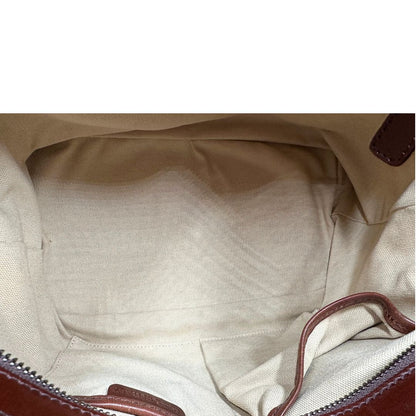Interno di una Borsa Tote Burberry in tessuto bianco trama tartan nera e rossa, finiture in pelle marrone e parti metalliche effetto renio, munita di doppie manici e una tracolla regolabile, amovibile con spallaccio. Indossabile a spalla. Originale, usata, di lusso, in ottime condizioni.