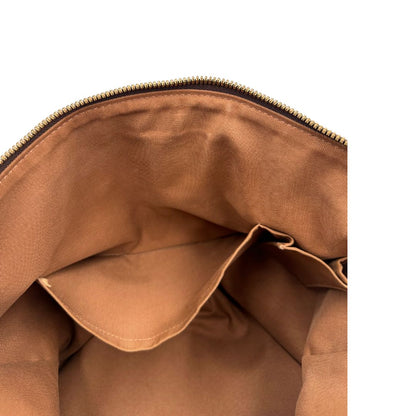 Tasca interna di una Borsa Palermo GM Louis Vuitton in canvas marrone monogram con finiture in vacchetta naturale e parti metalliche dorate. Originale, usato, di lusso, in ottime condizioni.