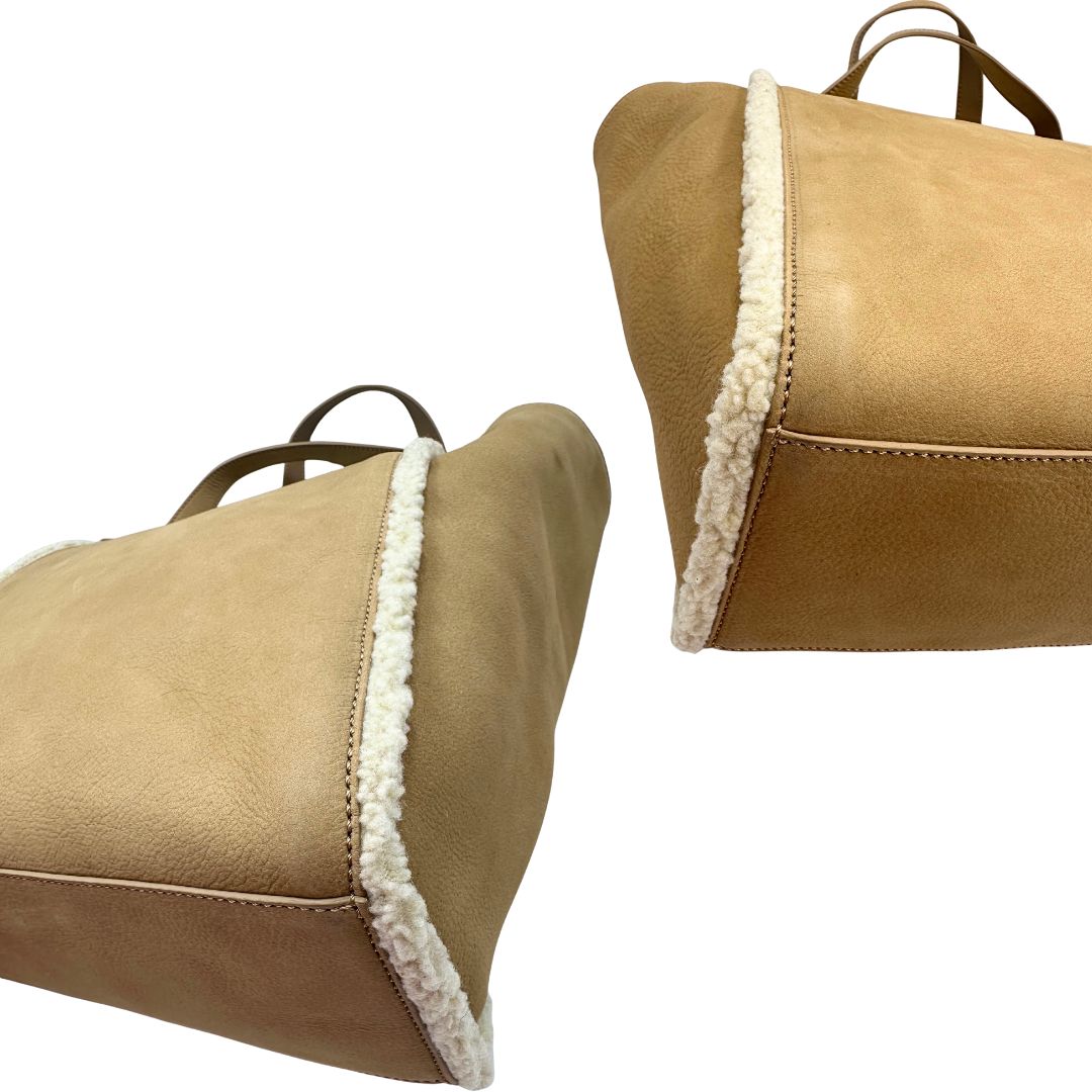 angoli Borsa Hogan in pelle scamosciata beige con finiture e interno effetto shearling; munita di doppi manici, da portare a spalla. Completa di dustbag, di lusso, originale, ottime condizioni. 