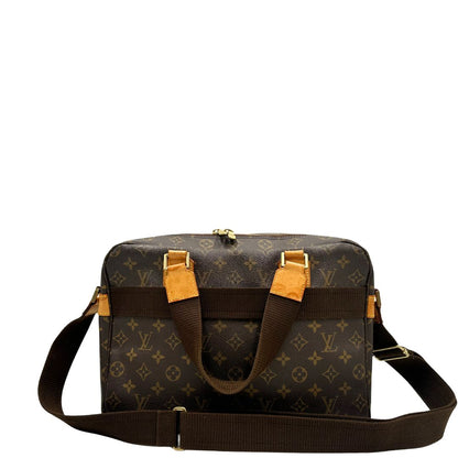 Retro di una Borsa Louis Vuitton in canvas marrone monogram con finiture in vacchetta naturale e parti metalliche dorate; munita di due manici e una tracolla in tessuto regolabile. Completa di dustbag. Originale, usata, di lusso, in ottime condizioni.