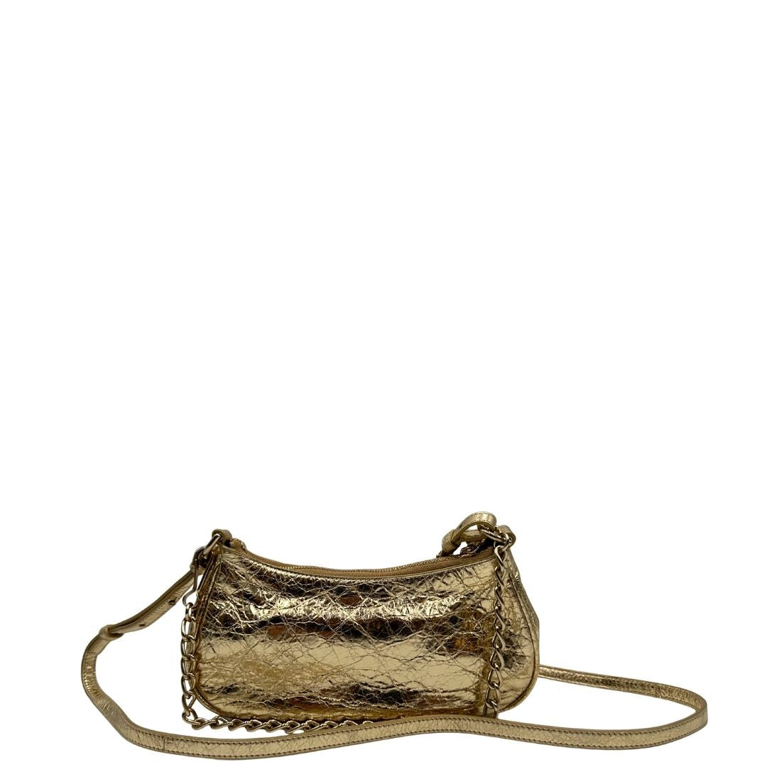 retro Borsa Balenciaga in pelle dorata con parti metalliche dorate, impreziosita da borchie con cristalli incastonati; munita di un manico in catena e una tracolla regolabile. Completa di dustbag, di lusso, originale, ottime condizioni. 