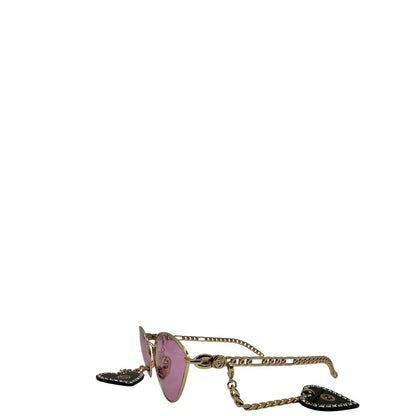 lato Occhiali da sole Gucci in metallo dorato e lenti rosa, muniti di due pendenti con cuore amovibili. Completi di sacchetto antipolvere, di lusso, originale, ottime condizioni. 