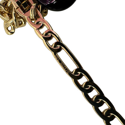 asticella Occhiali da sole Gucci in metallo dorato e lenti rosa, muniti di due pendenti con cuore amovibili. Completi di sacchetto antipolvere, di lusso, originale, ottime condizioni. 