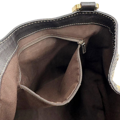 interno Borsa Gucci in tessuto GG beige con finiture in pelle marroni, impreziosita da da striscia Web sulla chiusura verde e rossa e parti metalliche dorate; munita di doppi manici, da portare a spalla, di lusso, originale, usata.