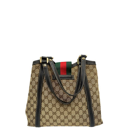 retro Borsa Gucci in tessuto GG beige con finiture in pelle marroni, impreziosita da da striscia Web sulla chiusura verde e rossa e parti metalliche dorate; munita di doppi manici, da portare a spalla, di lusso, originale, usata. 
