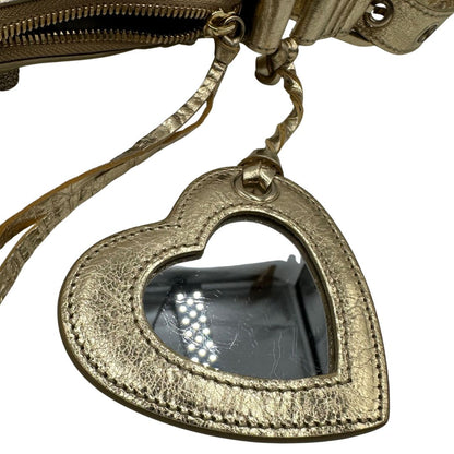 Borsa Balenciaga in pelle dorata con parti metalliche dorate, impreziosita da borchie con cristalli incastonati; munita di una tracolla regolabile. Completa di dustbag, di lusso, originale, ottime condizioni.