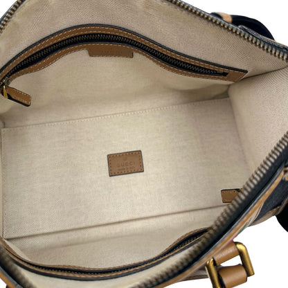 interno Borsa Gucci in tessuto GG nera con finiture in pelle marroni, dettagli Web verdi e rossi e parti metalliche dorate; munita di doppi manici stondati e una tracolla in tessuto amovibile e regolabile. Completo di dustbag, lucchetto e chiavi, di lusso, usata, originale.