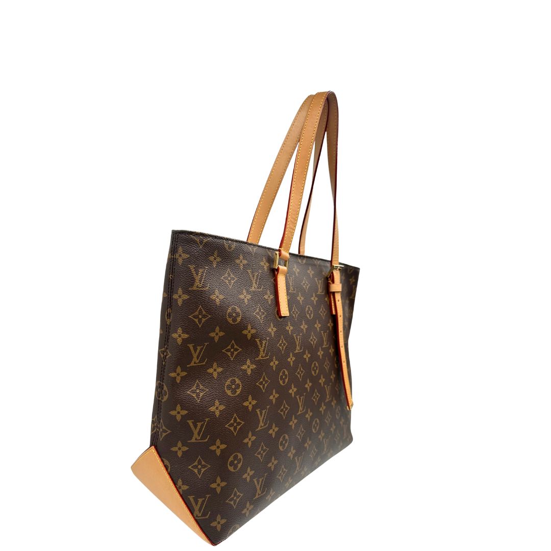 Lato destro di una Borsa Louis Vuitton Mezzo in canvas marrone monogram con finiture in vacchetta naturale e parti metalliche dorate; munita di doppi manici Leggermente regolabili. Indossabile a spalla. Originale, usato, di lusso, in ottime condizioni.