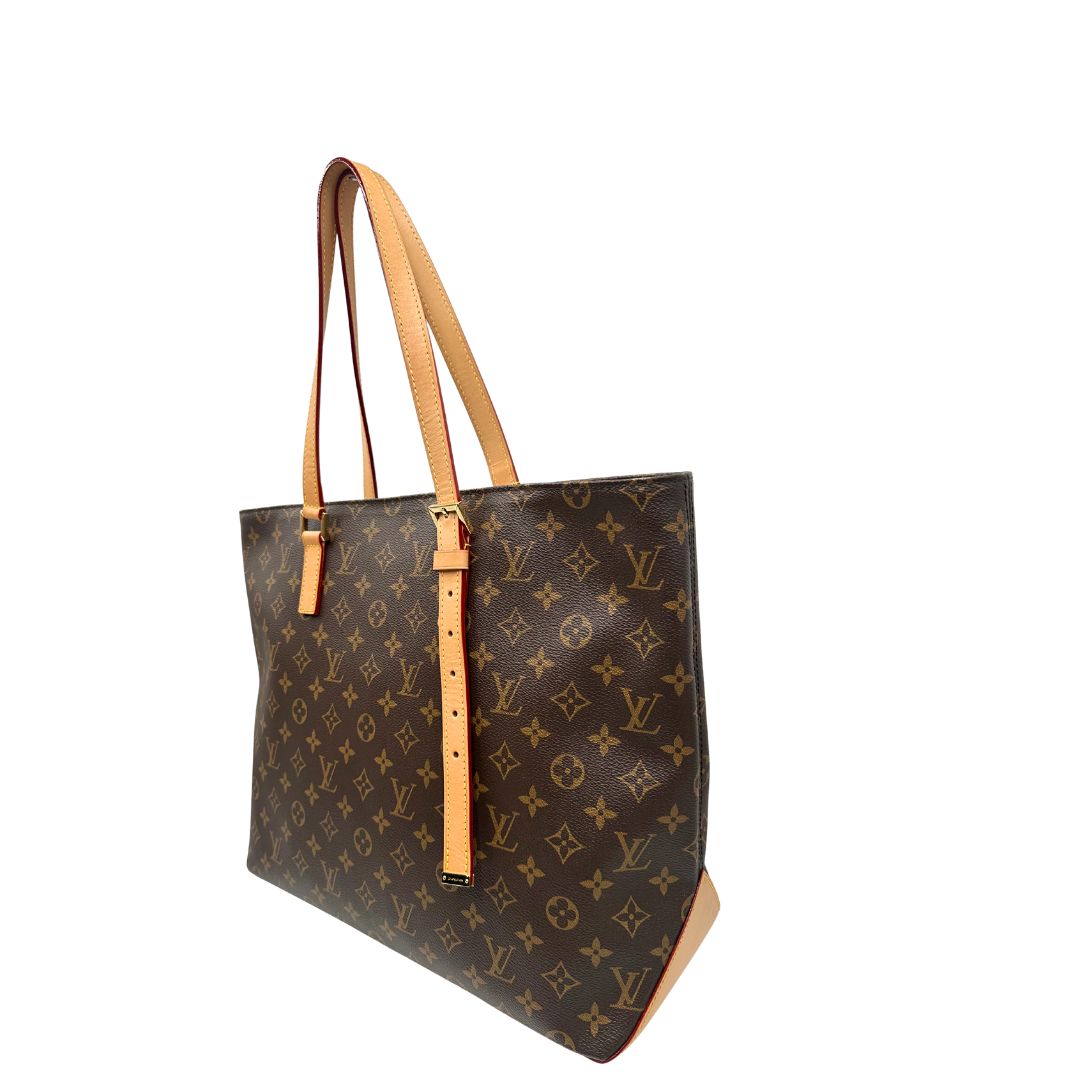 Lato singolo di una Borsa Louis Vuitton Mezzo in canvas marrone monogram con finiture in vacchetta naturale e parti metalliche dorate; munita di doppi manici Leggermente regolabili. Indossabile a spalla. Originale, usato, di lusso, in ottime condizioni.