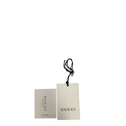 Cartellino di una Sciarpa Gucci reversibile in 100% lana rosa e grigia, con trama GG e sfrangiature sui bordi. Munita di cartellino. Originale, usato, di lusso, in condizioni eccellenti.