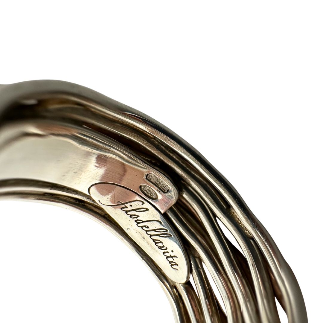 Tredici fili in Oro Rosa 9kt e Argento 925 arricchito al Palladio intrecciati sulla cui superficie risplendono sedici Diamanti Bianchi taglio brillante da 0.21 ct, di lusso, originale, ottime condizioni.