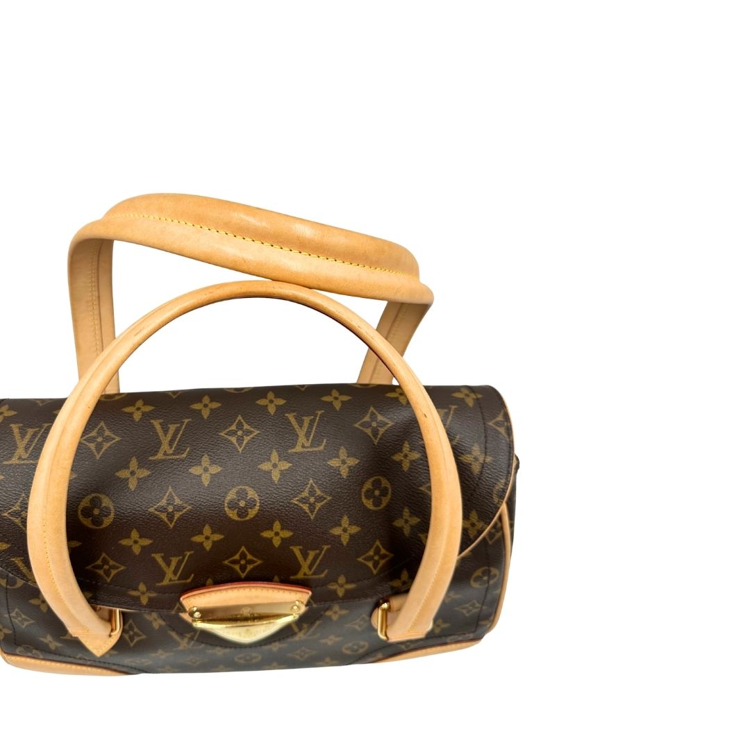 Manici di una Borsa Beverly LV in canvas marrone monogram, finiture in vacchetta naturale e metalleria dorata. Indossabile a spalla oppure a mano. Originale, usata, di lusso, in ottime condizioni.