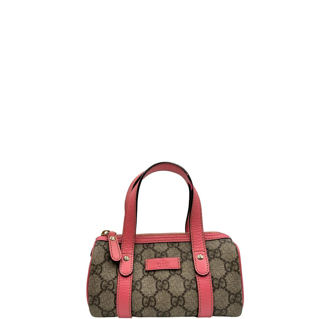 front Borsa Gucci in tessuto beige GG con finiture in pelle rosa e parti metalliche dorate; munita di doppi manici, indossabile a spalla. Completa di dustbag, di lusso, originale, ottime condizioni. 