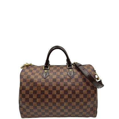 front Borsa Speedy 35 in canvas Damier Ébène marrone con finiture in pelle marrone e parti metalliche dorate; munita di una tracolla amovibile e regolabile e doppi manici stondati. Completa di scatola, lucchetto e chiavi, di lusso, originale, usata. 