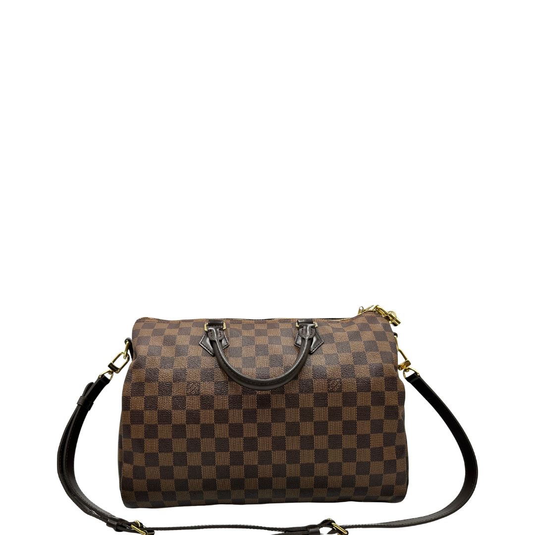 retro Borsa Speedy 35 in canvas Damier Ébène marrone con finiture in pelle marrone e parti metalliche dorate; munita di una tracolla amovibile e regolabile e doppi manici stondati. Completa di scatola, lucchetto e chiavi, di lusso, originale, usata. 