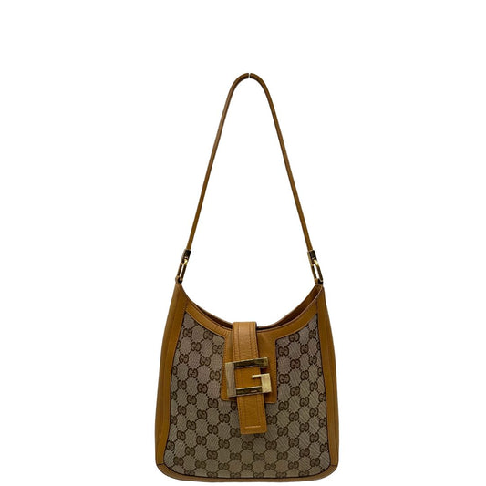 front Borsa Gucci in tessuto beige GG con finiture in pelle color cammello e parti metalliche dorate; munita di un manico singolo, indossabile a spalla. Completa di dustbag, di lusso, originale, ottime condizioni, usata. 