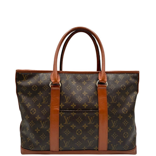 Front di un Sac Weekend Louis Vuitton in canvas marrone monogram con doppi manici stondati e parti metalliche dorate. Indossabile a mano. Originale, usata, di lusso, in ottime condizioni.