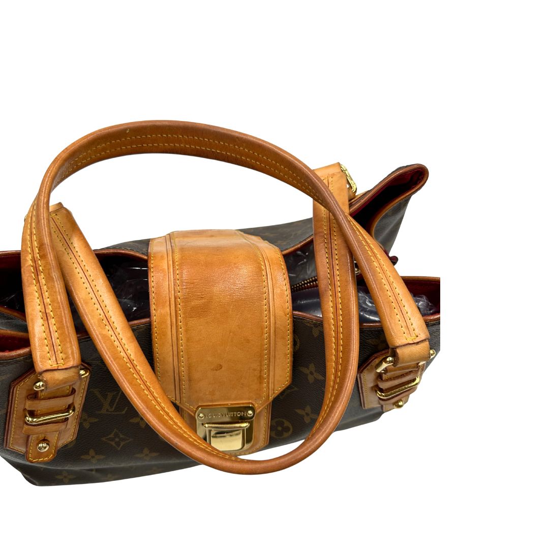 Manici di una Borsa Griet LV in canvas marrone monogram, finiture in vacchetta naturale e metalleria dorata. Indossabile a spalla oppure a mano. Originale, usata, di lusso, in ottime condizioni.