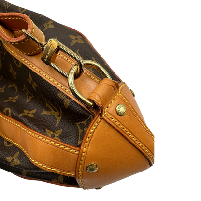 Zaino Louis Vuitton in canvas marrone monogram con finiture in vacchetta naturale e parti metalliche dorate; munita di un cinturino centrale con fibbia e un manico amovibili. Indossabile a spalla. Completa di dustbag. Originale, usata, di lusso, in ottime condizioni.