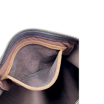 Tasca interna di una Borsa Speedy 35 in canvas marrone monogram con finiture in vacchetta naturale e parti metalliche dorate; munita di doppi manici stondati e una tracolla amovibile e regolabile. Completa di lucchetto e chiavi. Originale, usato, di lusso, in ottime condizioni.