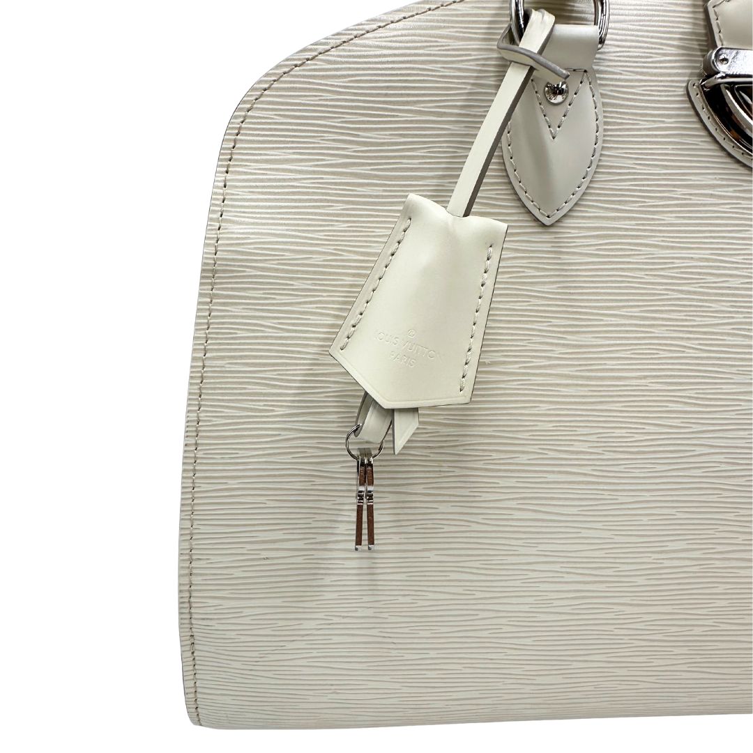 clochette Borsa Louis Vuitton in pelle epi bianco gesso con parti metalliche argentate; munita di doppi manici stondati, da portare a mano. Completa di lucchetto e chiavi, di lusso, originale, ottime condizioni, usata. 