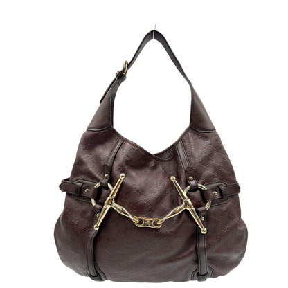 front Borsa Gucci in pelle GG color vinaccia con parti metalliche dorate; munita di un manico singolo e impreziosita da dettaglio Horsebit sul front. Completa di dustbag, di lusso, originale, ottime condizioni. 