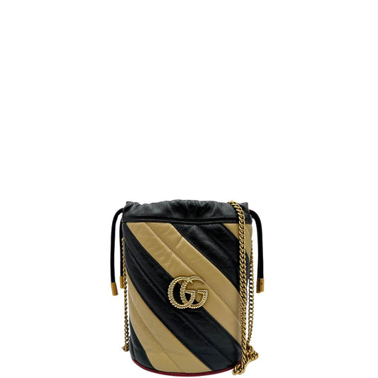 frojt Borsa Gucci in pelle bicolore crema e nera con parti metalliche dorate; munita di una tracolla in catena amovibile. Completa di corredo, di lusso, originale, ottime condizioni.
