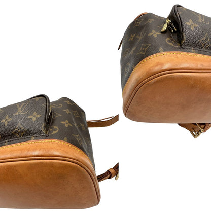 angoli Zaino Montsouris mini in canvas marrone monogram con finiture in vacchetta naturale e parti metalliche dorate, munito di un anello sulla parte superiore e due bretelle in vacchetta regolabili con fibbie, di lusso, originale, ottime condizioni. 