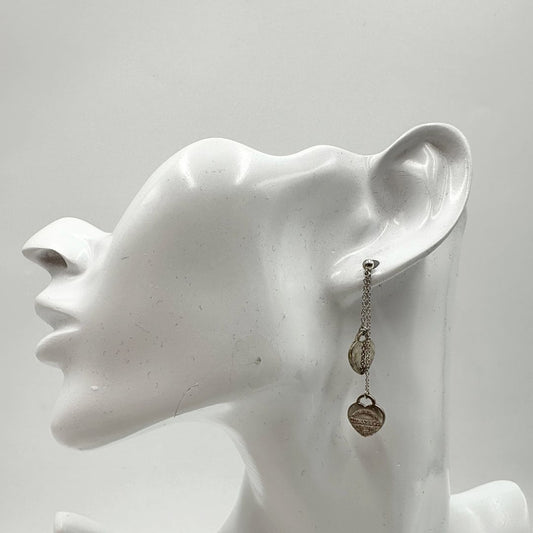Orecchini Tiffany&Co. della collezione Return To Tiffany con pendenti a forma di cuore in argento 925. Completi di sacchetto, di lusso, originale, ottime condizioni, usata.