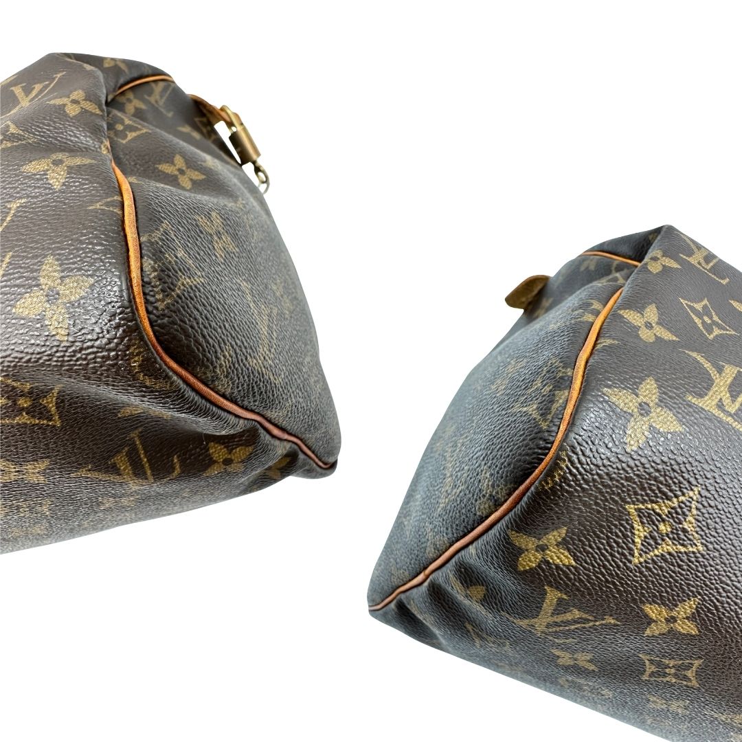 Borsa Louis Vuitton in canvas marrone monogram con finiture in vacchetta naturale e parti metalliche dorate; munita di doppi manici stondati. Completa di dustbag, lucchetto e chiavi, di lusso, originale, ottime condizioni.